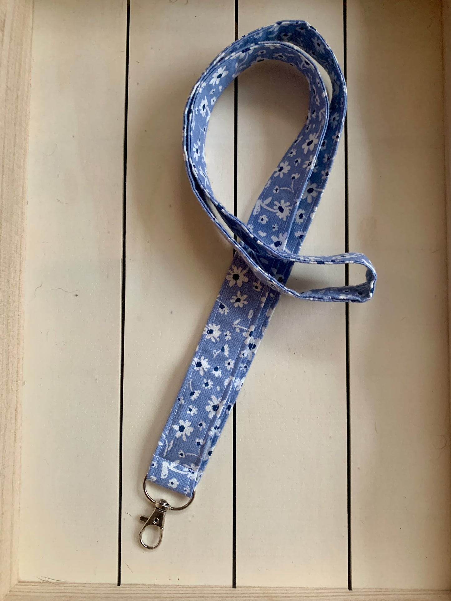 White Floral on Blue Lanyard